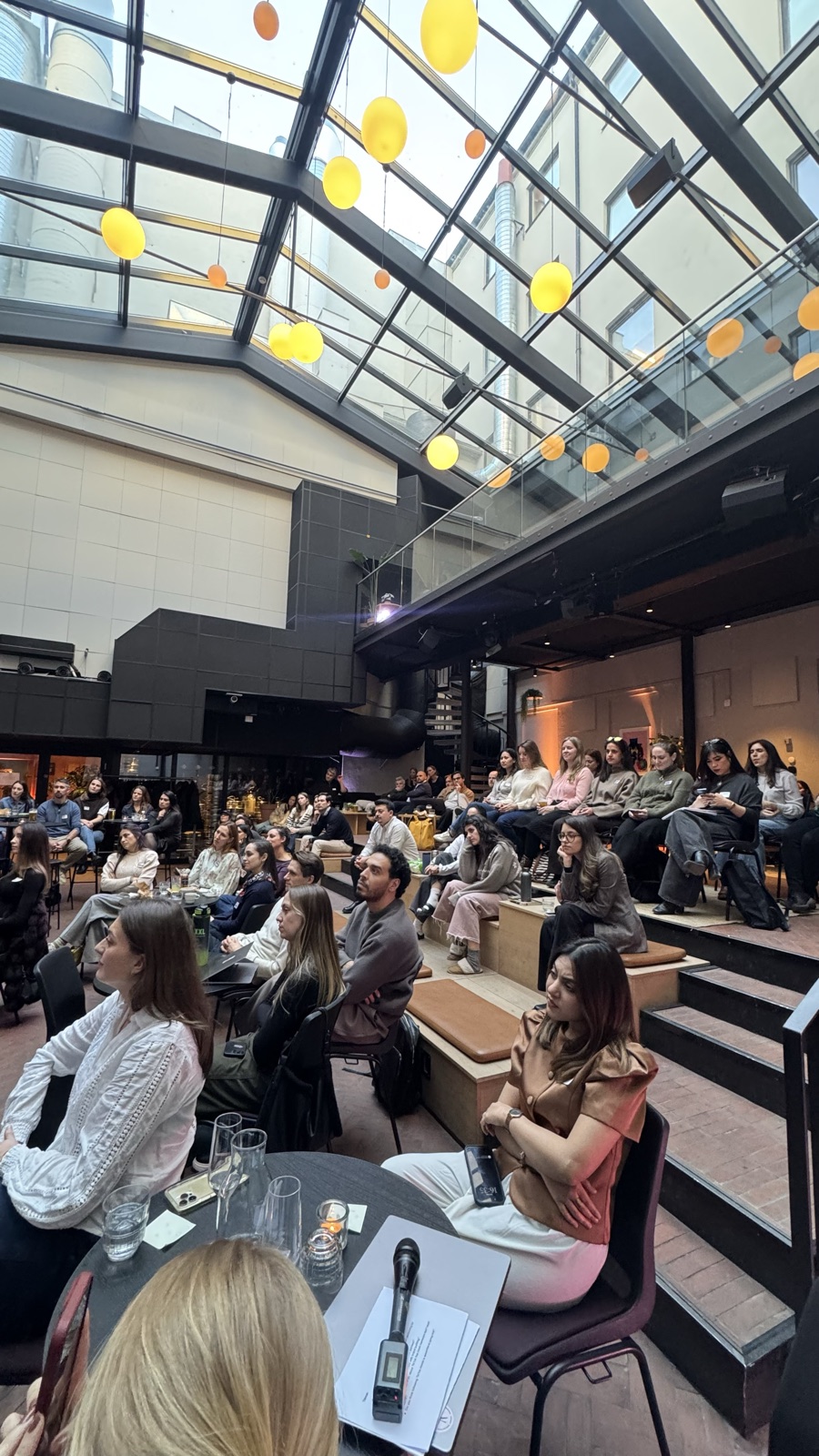 A packed courtyard at a Women in Marketing event